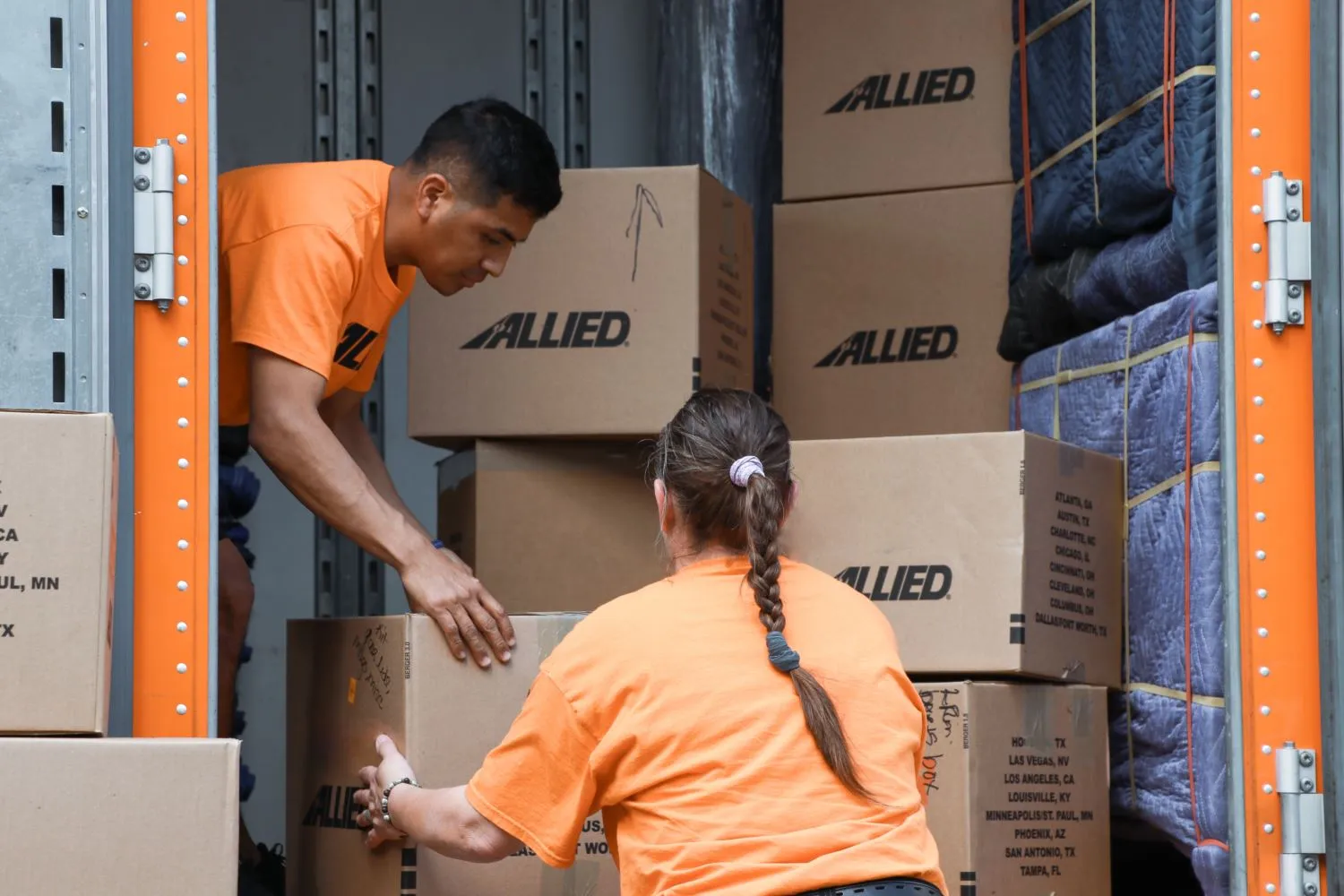 Allied movers loading boxes into truck